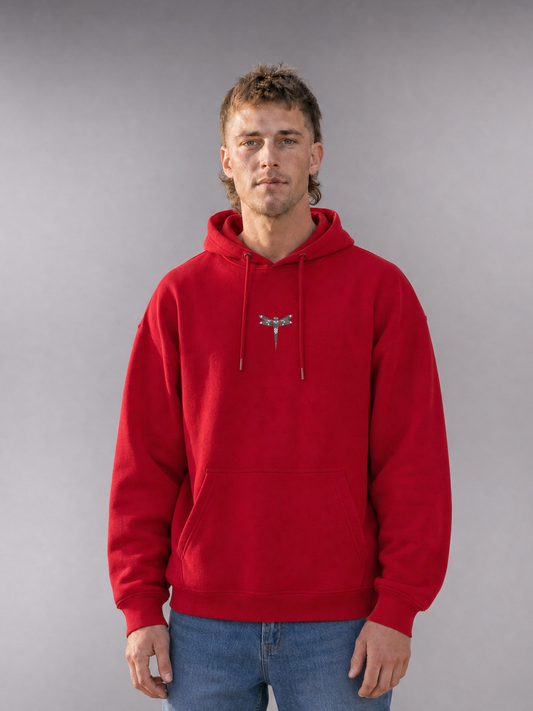 TRUST THE CHAOS Hoodie red - Frontansicht, getragen von männlichem Model, mit kleinem Libellen-Logo auf der Brust [KI]